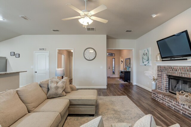 9207 Trenton Ave, Lubbock, TX 79424 - living area with wood finished floors, a ceiling fan, a brick fireplace, and vaulted ceiling