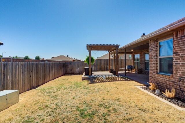 9207 Trenton Ave, Lubbock, TX 79424 - fenced backyard featuring a patio area and a pergola
