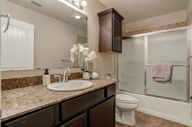 9207 Trenton Ave, Lubbock, TX 79424 - full bathroom with vanity and combined bath / shower with glass door