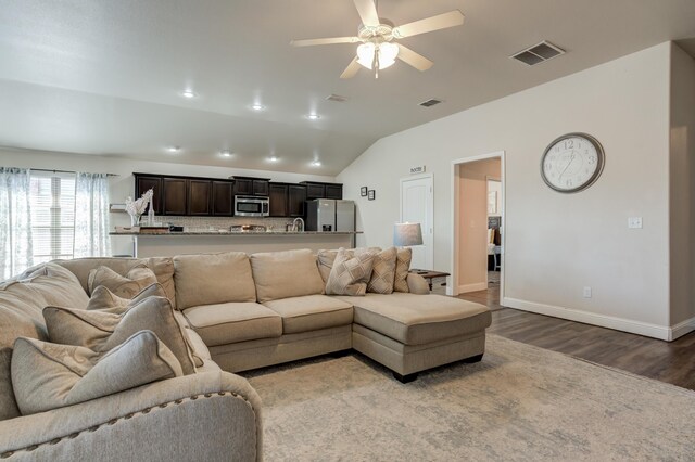 9207 Trenton Ave, Lubbock, TX 79424 - living area featuring wood finished floors, vaulted ceiling, and ceiling fan