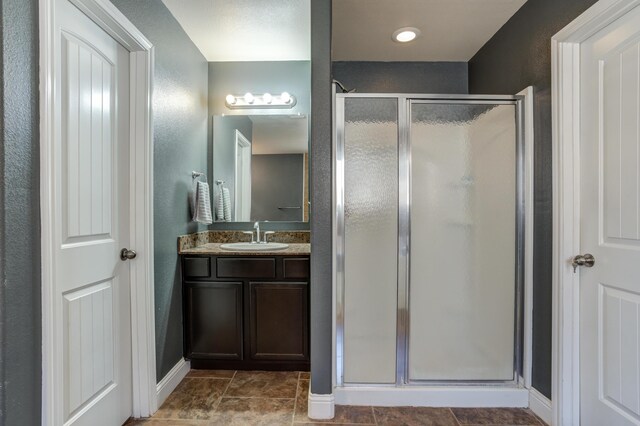 9207 Trenton Ave, Lubbock, TX 79424 - bathroom featuring a shower stall and vanity