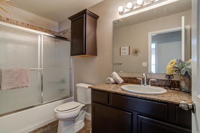 9207 Trenton Ave, Lubbock, TX 79424 - full bathroom with vanity, bath / shower combo with glass door, and tile patterned floors