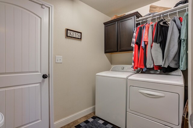 9207 Trenton Ave, Lubbock, TX 79424 - washroom featuring washer and clothes dryer and cabinet space