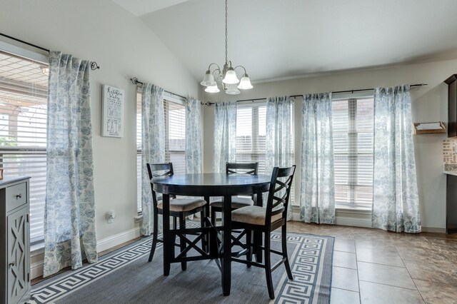 9207 Trenton Ave, Lubbock, TX 79424 - dining space featuring a chandelier, vaulted ceiling, and light tile patterned flooring