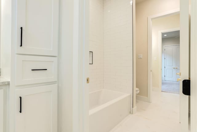 bathroom featuring toilet and tub / shower combination