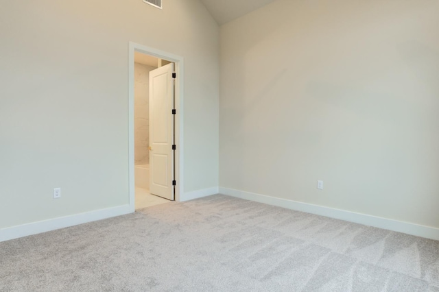 spare room with light colored carpet