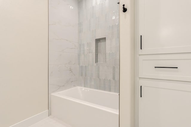 bathroom featuring shower / tub combination and tile patterned flooring