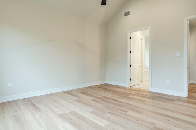 unfurnished room featuring ceiling fan, high vaulted ceiling, and light hardwood / wood-style flooring