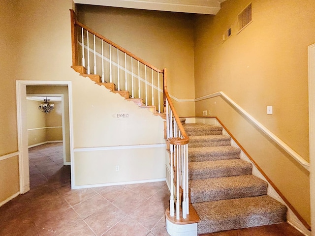 stairway featuring tile patterned floors