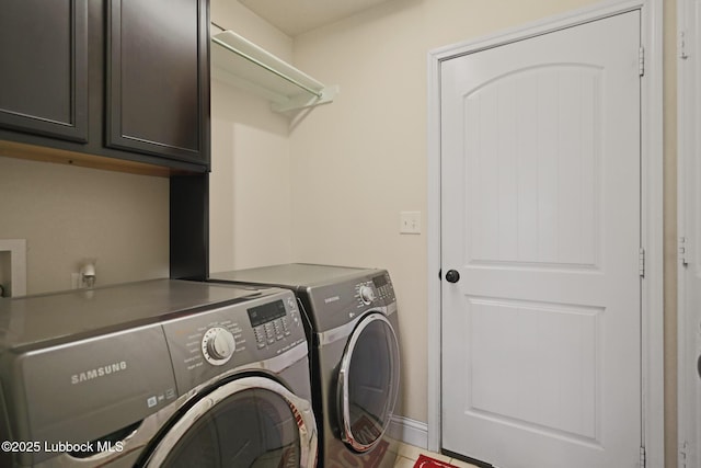 11104 Englewood Ave, Lubbock, TX 79424 - clothes washing area featuring washer and clothes dryer and cabinet space