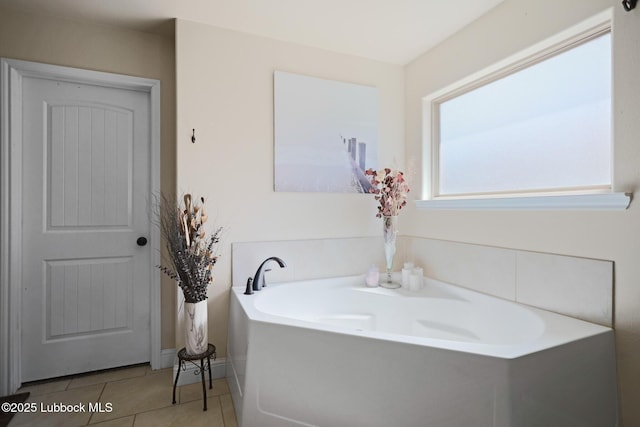11104 Englewood Ave, Lubbock, TX 79424 - full bath with tile patterned flooring and a garden tub