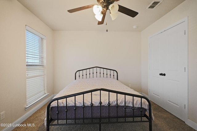 11104 Englewood Ave, Lubbock, TX 79424 - carpeted bedroom with baseboards, ceiling fan, and visible vents
