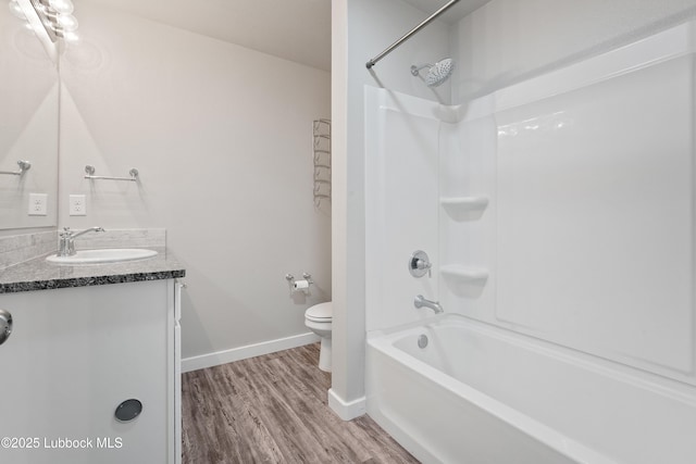 3222 Waverly Ave, Lubbock, TX 79407 - bathroom with wood finished floors, vanity, and bathing tub / shower combination