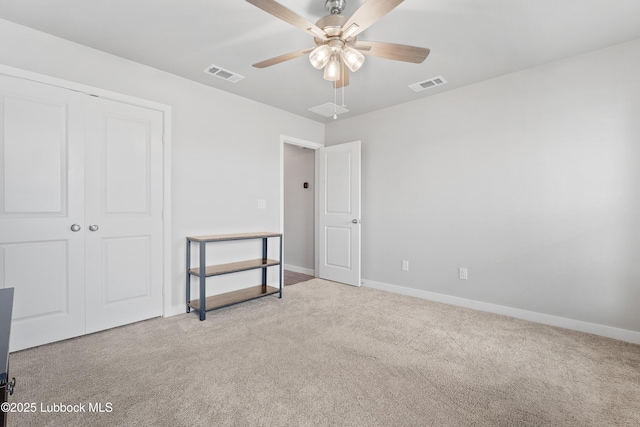 3222 Waverly Ave, Lubbock, TX 79407 - unfurnished bedroom with carpet flooring, a closet, and a ceiling fan
