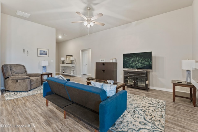3222 Waverly Ave, Lubbock, TX 79407 - living room with light wood finished floors and a ceiling fan