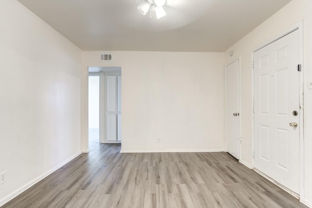 unfurnished room featuring light hardwood / wood-style floors