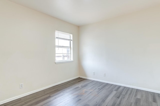 unfurnished room featuring hardwood / wood-style flooring