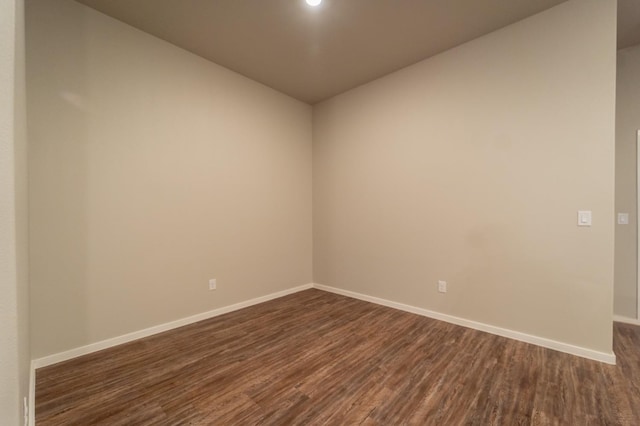 empty room featuring dark hardwood / wood-style flooring