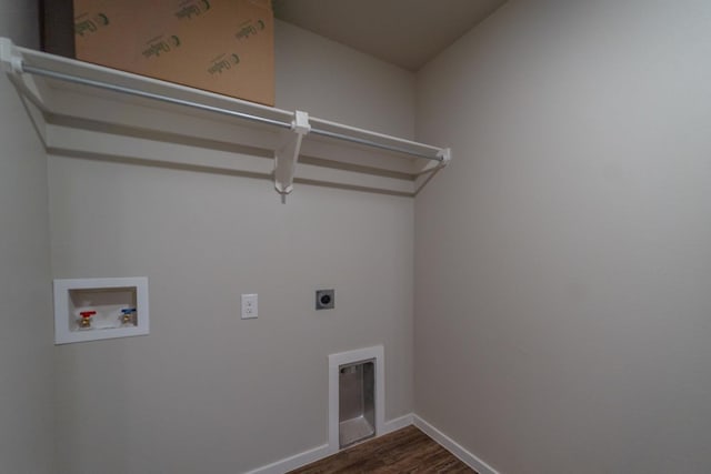 laundry room featuring electric dryer hookup, hookup for a washing machine, and dark hardwood / wood-style flooring