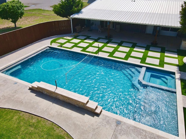 view of swimming pool featuring an in ground hot tub and a patio