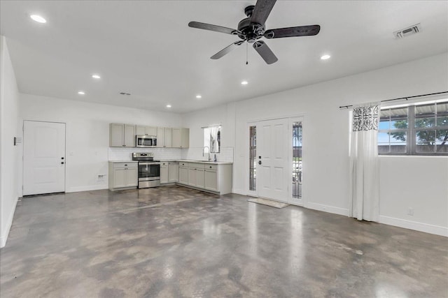 interior space with sink and ceiling fan