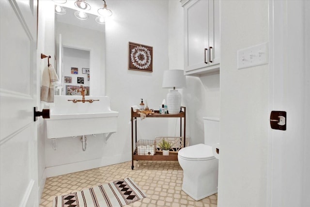 bathroom with sink and toilet