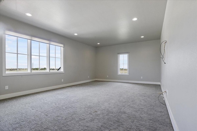 unfurnished room featuring carpet flooring