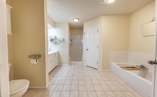 10609 Elkridge Ave, Lubbock, TX 79423 - bathroom featuring a shower stall, vanity, a bath, tile patterned floors, and a textured ceiling