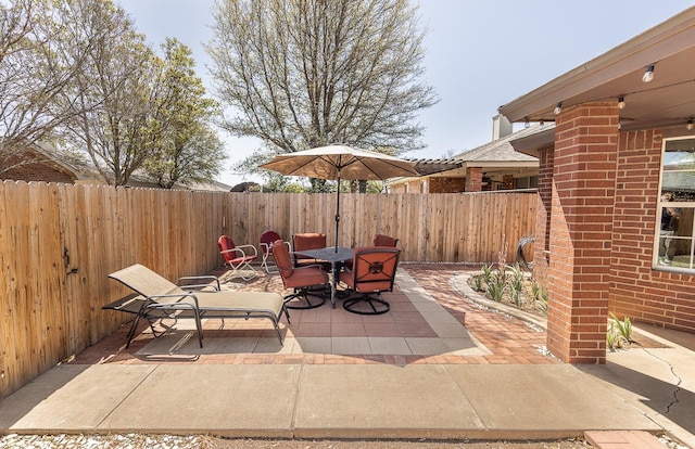 10609 Elkridge Ave, Lubbock, TX 79423 - fenced backyard featuring a patio and outdoor dining area