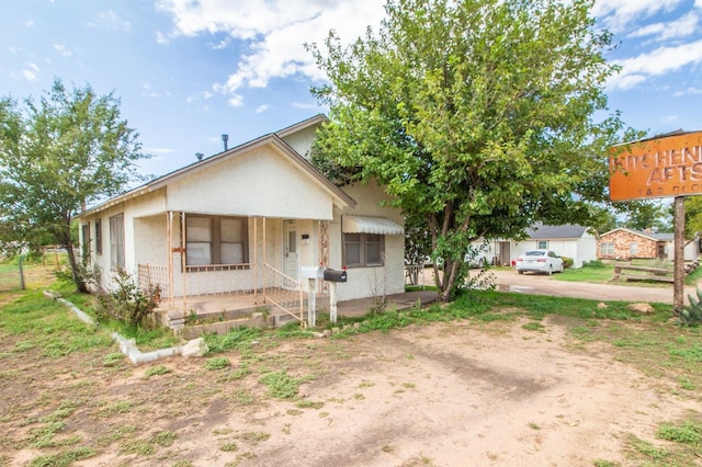 view of front of home featuring covered porch