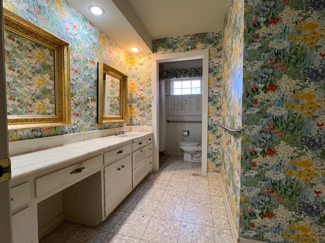 bathroom with vanity and toilet