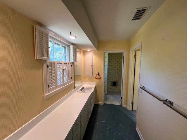 corridor featuring sink and dark parquet floors