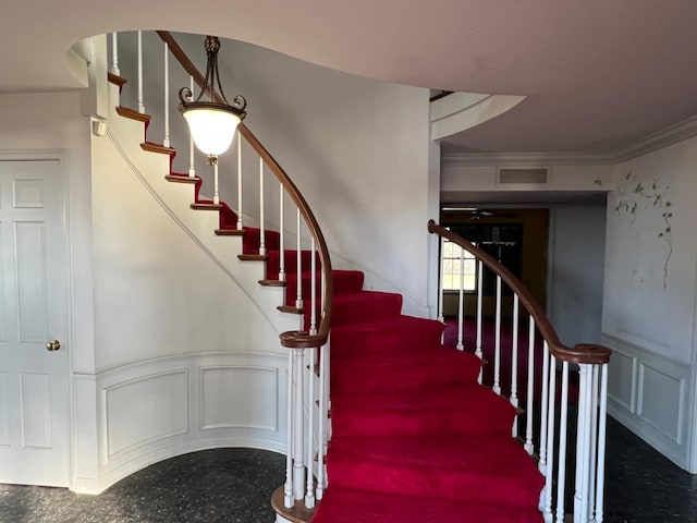 stairs with crown molding