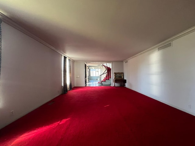 unfurnished living room with crown molding and carpet flooring