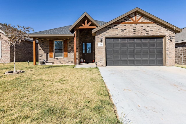 view of front facade with a garage and a front lawn