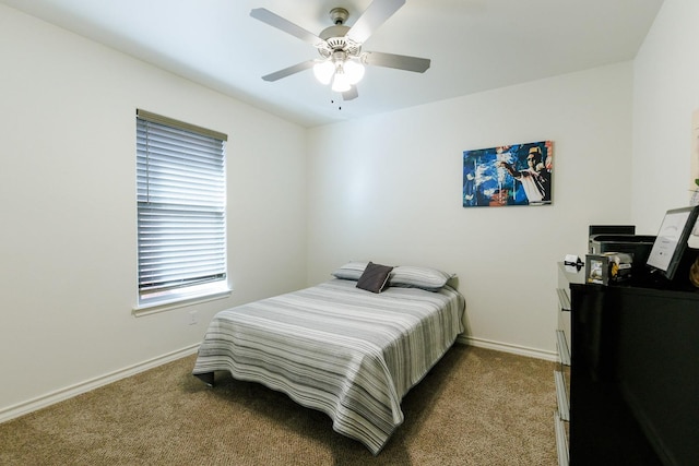 bedroom featuring dark carpet and ceiling fan