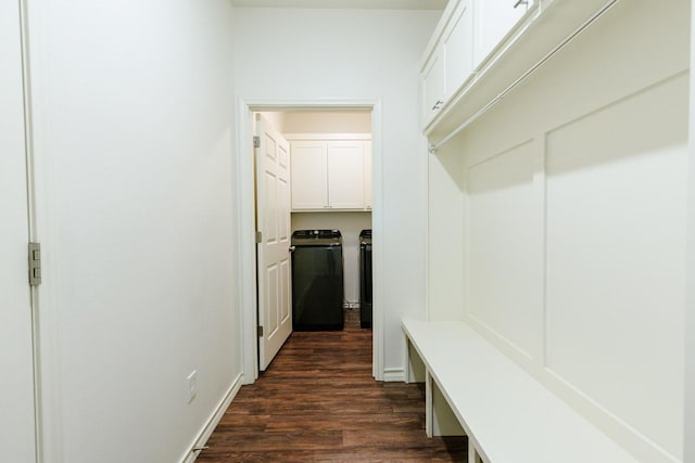 mudroom with independent washer and dryer and dark hardwood / wood-style flooring