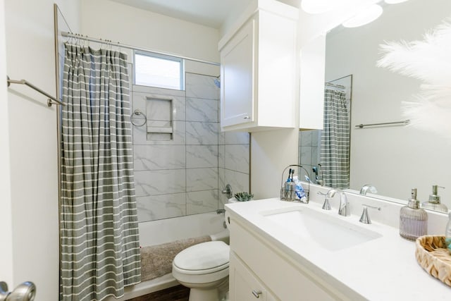 full bathroom featuring vanity, toilet, and shower / tub combo