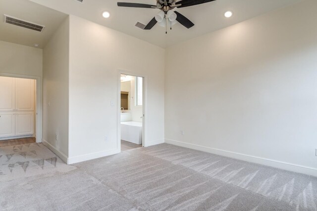7615 52nd St, Lubbock, TX 79407 - unfurnished bedroom with light carpet, baseboards, recessed lighting, and ensuite bathroom