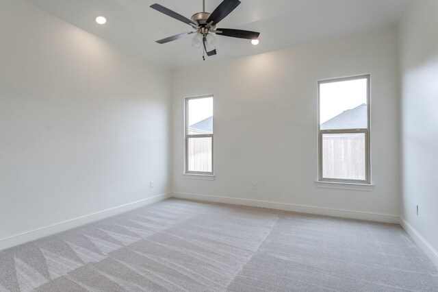 7615 52nd St, Lubbock, TX 79407 - spare room with light carpet, baseboards, a ceiling fan, and recessed lighting