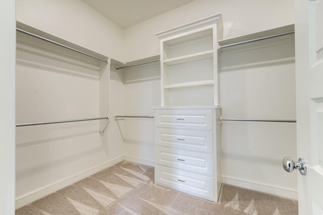 7615 52nd St, Lubbock, TX 79407 - walk in closet featuring carpet floors