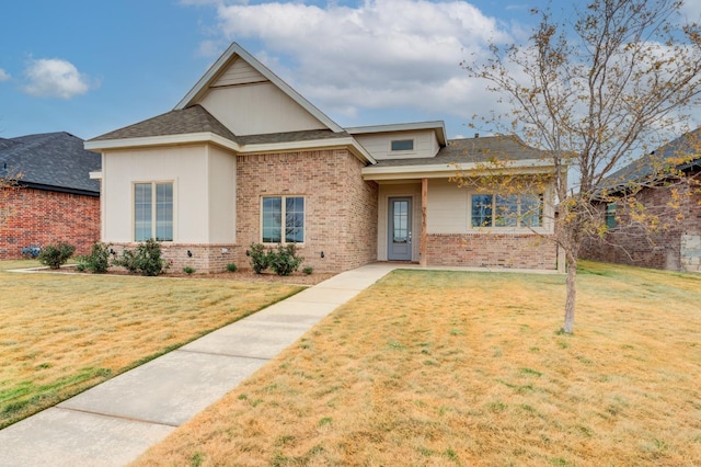 7615 52nd St, Lubbock, TX 79407 - view of front facade featuring brick siding and a front lawn