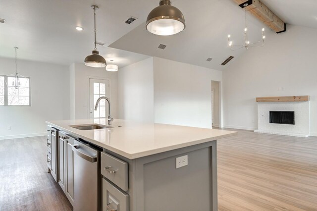 7615 52nd St, Lubbock, TX 79407 - kitchen featuring a sink, dishwasher, gray cabinetry, light wood-type flooring, and baseboards