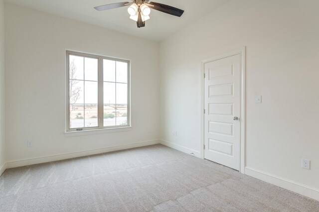 7615 52nd St, Lubbock, TX 79407 - empty room featuring light carpet, ceiling fan, and baseboards