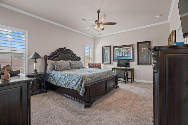 carpeted bedroom featuring ceiling fan and ornamental molding