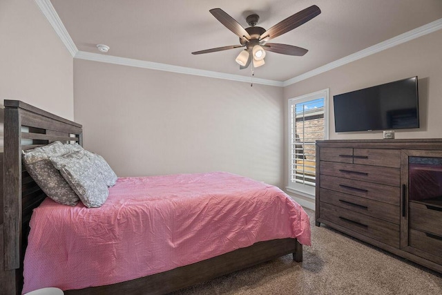 bedroom featuring crown molding, light colored carpet, and ceiling fan