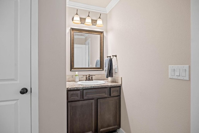 bathroom with vanity and ornamental molding