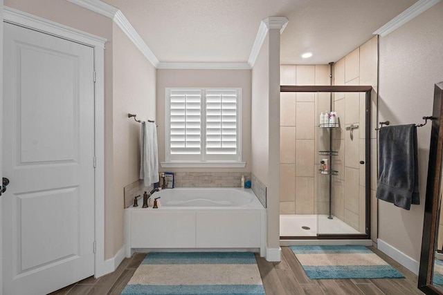 bathroom featuring independent shower and bath, crown molding, and hardwood / wood-style flooring