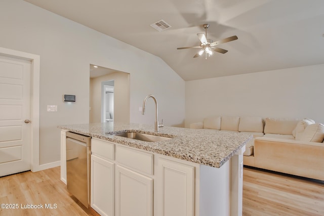 2933 Abbeville Ave, Wolfforth, TX 79382 - kitchen with stainless steel dishwasher, open floor plan, light wood-type flooring, a ceiling fan, and lofted ceiling