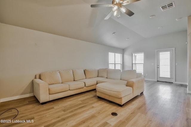 2933 Abbeville Ave, Wolfforth, TX 79382 - living room with lofted ceiling, ceiling fan, light wood-style flooring, and healthy amount of natural light